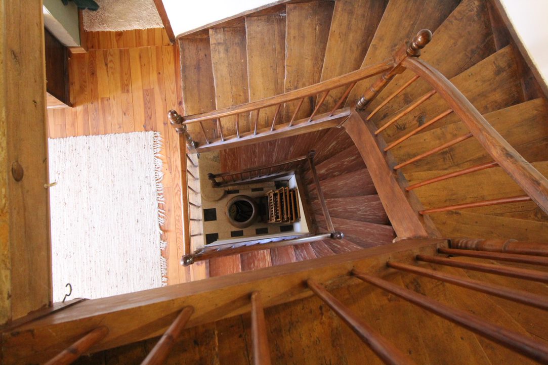 A view of a staicase looking down from the top